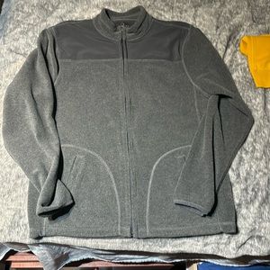 Crewneck zip up has wind breakers for the shoulder’s it a size M